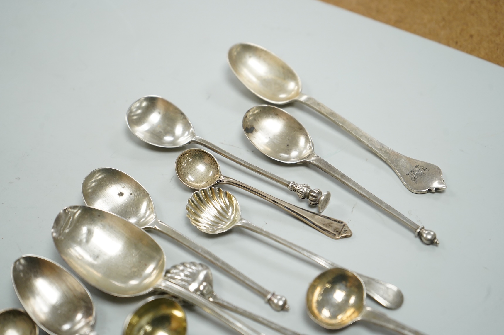 A collection of assorted 19th century and later silver flatware, including two George III table spoons, London, 1808 and 1804, various pattern, dates and makers, 13.1oz.
